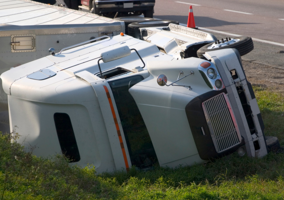 truck accident on a shoulder of a freeway