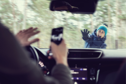 car hitting a pedestrian because the driver is texting while driving